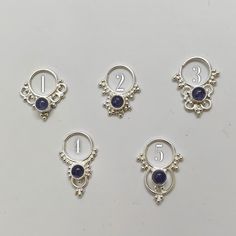 "These are soooooo pretty. Made is 925 sterling silver with tribal details, set with an alluring tanzanite stone. The rings are all 1cm (.40\") in diameter. The wire is 18 gauge. Each piece is made BY HAND so there may be very slight differences One of the images contains numbers to specify which you would like from the drop down menu." Sterling Silver Body Jewelry As Gift, Unique Sterling Silver Body Jewelry For Gifts, Unique Sterling Silver Body Jewelry Gift, Sterling Silver Body Jewelry, Bohemian Sterling Silver Body Jewelry As Gift, Bohemian Sterling Silver Body Jewelry Gift, Bohemian Sterling Silver Body Jewelry For Gift, Bohemian Silver Amethyst Ring In Sterling Silver, Celestial Sterling Silver Jewelry