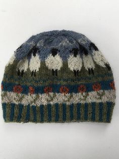 a knitted hat with an animal pattern on it