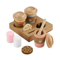 a wooden play food set with donuts and cups