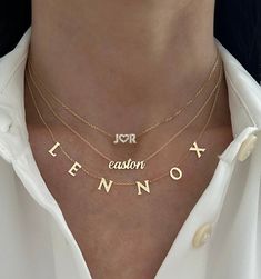 This adorable small all DIAMOND name necklace is the perfect accessory! It looks great alone or layered with other necklaces. UPPERCASE letters only. HEARTS COUNT AS LETTERS! Example shown is 3 letters. WE WILL NOT PROCESS YOUR ORDER IF YOU DO NOT SELECT THE RIGHT AMOUNT OF LETTERS. Available in 14K Yellow Gold or 14K White Gold Height: Approx. 0.18" (very dainty) Stones: diamonds Length: Based on number of letters Price is based on the number of letters in the custom text ALL UPPERCASE LETTERS Vietnam Jewelry, Name Necklace Aesthetic, Necklace Name Design, Diamond Name Necklace, Bracelet Board, Word Necklace, Necklace Aesthetic, Necklace Stack, Bethenny Frankel