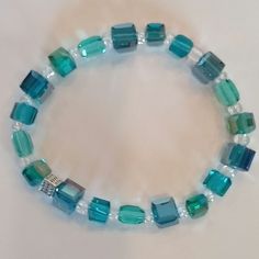 This beautiful multi color Turquoise Crystal Cube bracelet will add a perfect pop of color and sparkle to your wardrobe! Casual Turquoise Stretch Bracelet With Colorful Beads, Turquoise Crystal Bangle Bracelet As Gift, Turquoise Bangle Crystal Bracelet For Gift, Turquoise Bangle Crystal Bracelet As Gift, Trendy Turquoise Beaded Stretch Bracelet, Turquoise Stretch Bangle Bracelet As Gift, Turquoise Stretch Bangle Bracelet For Gift, Casual Turquoise Bracelets With Colorful Beads, Casual Turquoise Crystal Bracelet For Gift