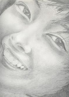 a pencil drawing of a smiling man's face