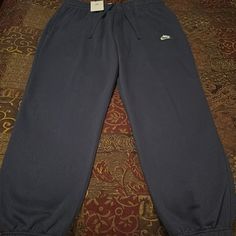 New! Mens Nike Sportswear Fleece Lined Elastic Ankle Sweatpants. Navy Color Way. Mens Size Xl Waist 17 Inseam 29.75. Drawstring Waist And Two Hand Pockets. Pristine Condition. See All Photos Navy Sporty Joggers For Loungewear, Sporty Navy Joggers For Loungewear, Blue Moisture-wicking Sweatpants For Loungewear, Casual Blue Nike Sweats, Casual Navy Sweatpants For Jogging, Nike Blue Sweatpants For Loungewear, Nike Blue Sweats For Loungewear, Comfortable Nike Pants With Pockets, Nike Navy Athleisure Activewear