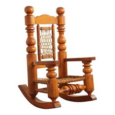 a wooden rocking chair with roped seat and foot rest on the bottom half of it