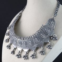 "Antique Silver Hindu Ganesha Bib Necklace. Nice old heavy piece 104.3 grams. Marked 80 in 4 places, I'm assuming that means 80% silver. I tested it and it tests over 80% but below sterling. Total length is about 14.5\" so it would fit most as a choker, it has an old cloth rope holding the bottom links together, one bottom dangle is missing but another could easily be removed to even it out." Antique Hallmarked Temple Necklace For Festivals, Antique Heavy Temple Necklace For Diwali, Traditional Heavy Silver Necklace, Antique Silver Temple Necklace For Festivals, Sterling Silver Temple Necklace For Festivals, Silver Temple Necklace For Ceremonial Festivals, Traditional Silver Temple Necklace Hallmarked, Ceremonial Silver Temple Necklace With Intricate Design, Silver Hallmarked Temple Necklace For Diwali