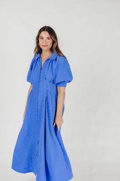 The Karsyn Midi Dress is a summertime must-have! This midi dress offers the comfortable shirt-dress silhouette we all love, but in an elevated design; its puffed short sleeves and darted bodice gives the Karsyn a flattering, feminine fit, while the beautiful textured fabric is lightweight and an eye-catching hue, perfect for all your summer jaunts. FIT: Runs true to size. MATERIAL: Shell: 100% Polyester; Lining: 100% Cotton. Hand wash cold; not not bleach, do not tumble dry. Iron low. GARMENT DE Dress With Puffed Sleeves, Curve Model, Midi Shirt Dress, Dress Silhouette, All Love, Puffed Sleeves, Textured Fabric, Love Is All, Puff Sleeve