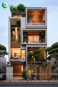 an apartment building with many balconies and plants on the top floor is shown