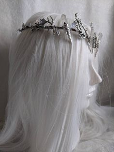 As serene as the silver moon, this tiara captures the essence of the glistening night sky as the moonlight paints the forest below a stunning silver, illuminating the landscape with an icy glow. This tiara features silver leaves surrounding the piece, a crescent moon, silver branches, and five silver titanium colored quartz (or clear quartz if you choose). This tiara is a unique and gorgeous handmade piece that will make a great gift. Moon Tiara, Moonlight Painting, Silver Core, Crystal Moon, Color Quartz, Silver Leaves, Silver Moon, The Landscape, Silver Leaf