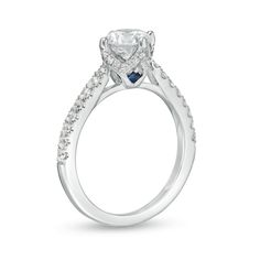 a diamond and blue sapphire engagement ring