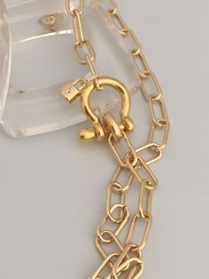 A beautiful shiny gold chain made up of paperclip links. The chain is brass and has several plating coatings of color to give the gold electroplated finish. It is a high quality choker chain. The shackle clasp gives the necklace a modern and unusual edge. It is Gold Plated. Size 21 x 25 mm To finish off this necklace I added a small CZ padlock with a CZ bail. The padlock also features a CZ star. For anyone that has difficulty with necklace closings this one is a breeze! If you look at the pictur Chic Gold Link Paperclip Bracelet, Gold Chain Link Paperclip Bracelet With Lobster Clasp, Trendy Gold Paperclip Chain Bracelet, Gold Chain Link Paperclip Bracelet, Chic Gold Toggle Necklace With Paperclip Chain, Gold Toggle Necklace With Paperclip Chain, Gold Chic Toggle Necklace With Paperclip Chain, Gold Link Paperclip Bracelet With Lobster Clasp, Gold Paperclip Link Bracelet With Lobster Clasp