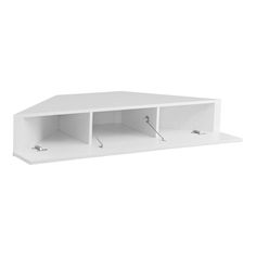 a white shelf with two open shelves on each side