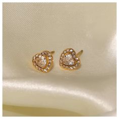 These gorgeous 18K Gold Heart Shaped Earrings are one of our best sellers! Perfect for every occasion such as Christmas Gifts, Anniversary Gifts, Birthday Gifts, Weddings, etc. These 18K Gold Heart Shaped Earrings are gold plated studs with a high quality cubic zirconia. TARNISH FREE, WATER PROOF AND HYPOALLERGENIC You will be impressed and satisfied with how much the cubic zirconia shine and glimmer in the light! These 18K Gold Heart Shaped Earrings ship in one business day after you complete y Heart Shape Studs Gold, Gold Heart Cut Earrings For Wedding, Anniversary Gold Plated Heart Earrings, Gold Heart Cut Wedding Earrings, Gold Plated Heart Cut Earrings For Anniversary, Gold Heart Earrings Gift For Her, Gold Heart-shaped Earrings As Gift For Her, Gold Heart Earrings As A Gift For Her, Gold Heart-shaped Earrings For Her