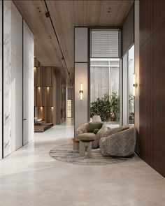 an elegant living room with modern furniture and wood paneling on the walls, along with potted plants