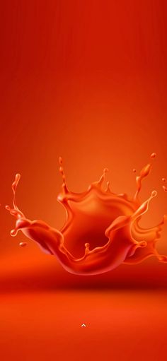 an orange liquid splashing into the air