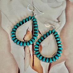 Genuine Kingman Turquoise 925 Sterling Silver Teardrop Hoop Earrings.  These are such a gorgeous pair of genuine Kingman turquoise earrings.  24 teardrop shaped stones form a teardrop shaped hoop earring.  The stones are such a beautiful turquoise color.  Nobody will miss seeing these beauties around your face....perfect at 2". * Genuine Kingman Turquoise * Handcrafted and Hallmarked 925 Sterling silver * 2" long by  1.5" wide * 14.70 grams * Lightweight .3oz each * FREE SHIPPING Not Native Made Teardrop Hoop Earrings, Turquoise Western, Sparkly Things, Black Gift Boxes, Kingman Turquoise, Genuine Turquoise, Etsy Earrings Dangle, Turquoise Color, Jewelry Earrings Hoops