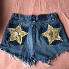 Nasty Gal After Party Levis Denim Distressed Shorts With Gold Stars On The Back #Nastygal #Levis #Afterparty Originally $88 Never Worn Star Jean Shorts, Denim Blue High Waist Bottoms With Star Print, High Waist Denim Blue Bottoms With Star Print, High Rise Denim Blue Bottoms With Star Print, Fitted Denim Bottoms With Star Print, Denim Blue Summer Bottoms With Star Print, Summer Denim Blue Star Print Bottoms, Trendy High Waist Jean Shorts For Parties, Summer Star Print Denim Jeans