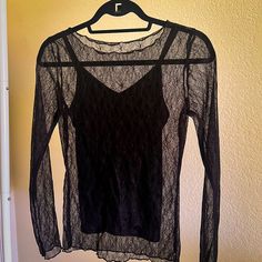 Never Worn Black Long Sleeve Lace Top Over Attached Black Camisole. Size Small Purchased From Vici. Brand Is Wishlist. Lace Top With Built-in Bra For Night Out, Party Lace Trim Cami Top, Lace Trim Cami Top For Party, Sheer Stretch Mesh Camisole Top, Elegant Long Sleeve Tops With Built-in Bra, Sheer Lace Camisole Top, Lace Cami Top For Party, Black Lace Top With Spaghetti Straps For Spring, Black Lace Top With Spaghetti Straps For Summer