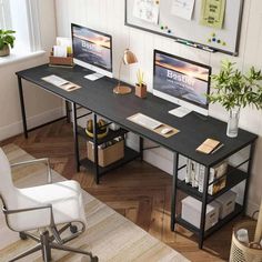 a desk with two computer monitors on top of it next to a chair and potted plant