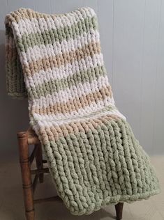 a chair with a knitted blanket on it