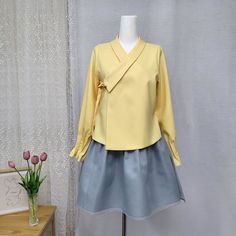 This is a Korean Modern Hanbok Blouse/Shirt(Jeogori) for Women. This blouse is made of two layers for the body part and one layer for the sleeve part, making it light and comfortable to wear. The unique shape of the collar and the wrist design with pretty pin tucks add a special touch. This hanbok is modernly designed so you can wear it comfortably and beautifully. This modern hanbok is perfect dress for daily and celebrations such as parties or various events. ⭐This blouse can be made in custom sizes. Please contact me if you would like to make your size. 🟠 Decorate more stylishly with accessories that go well with Hanbok. 🟠 Go look hanbok accessories: https://www.etsy.com/shop/LunarJogak?ref=seller-platform-mcnav&section_id=33148097 ⭐ FREE Shipping from Korea. The color of the clothes Spring Fake Two-piece Blouse, Elegant Fitted Long Sleeve Hanbok, Formal Yellow Long Sleeve Blouse, Korean Hanbok Modern, Hanbok Women, Hanbok Accessories, Modern Hanbok Dress, Casual Party Dress, Modern Hanbok