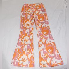 Colorful Orange And Pink Patterned Flare Pants 70s Groovy Floral Style Size Large But Run More Like A Medium; Very Stretchy New With Tags From Amazon Retro Stretch Bottoms With Floral Print, Retro Fitted Floral Print Bottoms, Groovy Wide Leg Spring Bottoms, Groovy Wide Leg Bottoms For Spring, Summer Retro Flare Bottoms, Spring Groovy Wide Leg Bottoms, Retro Flare Bottoms For Summer, High Waist Peach Bottoms For Spring, Pink Floral Print Wide Leg Bottoms