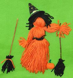 an orange and black scarecrow with two brooms on a green background, one is wearing a witch's hat