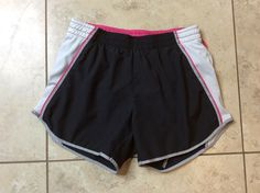 THIS IS A GREAT PAIR OF BLACK WHITE PINK & GRAY FIT DRY ATHLETIC RUNNING SHORTS FROM NIKE IN A WOMENS SIZE XS  (0-2) IN VERY GOOD CONDITION.  THESE SHORTS HAVE AN ELASTIC WAIST WITH DRAWSTRING, 100% POLYESTER, 3 3/4  INCH INSEAM, WAIST WILL STRETCH FROM 24 TO 32 INCHES, PANTY LINED.  AWESOME SHORTS!!!  WINNING BIDDER TO PAY WITHIN 4 DAYS AND ADD $4 FOR U.S. SHIPPING. NO INTERNATIONAL BIDDERS. NO REFUNDS. ALL SALES FINAL SO CHECK MEASUREMENTS. CHECK OUT MY OTHER AUCTIONS TO SAVE ON COMBINED SHIPP Nike Sporty Athletic Fit Shorts, Nike Sporty Gym Shorts, Nike Sporty Workout Shorts, Nike Athletic Shorts With Built-in Shorts For Sports Season, Nike Sportswear Shorts For Sports, Nike Sporty Athletic Shorts For Training, Nike Breathable Sporty Athletic Shorts, Nike Sporty Training Shorts, Nike Go-dry Athletic Shorts For Jogging