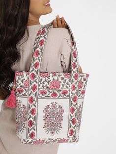 No journey is too long with the right company, and a beautiful tote handbag. Meticulously handcrafted, this gorgeous block printed tote is the perfect fun and functional accessory for life's everyday adventures. Reinforced with sturdy cotton buckram for structure, the tote is fully lined on the inside with block printed fabric, it also has two handy slip pockets inside, and one on the outside. It has a sturdy brass zip closure that is beautifully accented with a lovely, unique handmade tassel. An enchanting gift for yourself and for all the special women in your life - moms, aunts, grandmas, teachers and friends! Tote Bag Luxury, Block Printed Fabric, Everyday Adventures, Bag Luxury, Block Printing Fabric, Functional Accessories, Tote Handbag, Print Tote, Printed Fabric