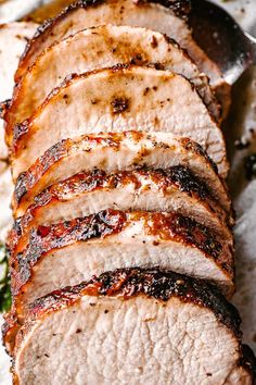 slices of pork on a plate with parsley