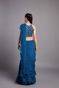 Georgette pre-draped ruffle saree paired with a zardozi and glass beads embroidered halter blouse From Chamee and Palak 's Alora collectionDELIVERY TIMEPlease allow 8-12 weeks for your outfit to arriveFABRIC DETAILSGeorgette and raw silkProfessional cleaning only Party Wear Pre-draped Saree With Mirror Work For Navratri, Designer Party Wear Pre-draped Saree For Eid, Fitted Pre-draped Saree With Ruffles For Designer Wear, Festive Embellished Art Silk Pre-draped Saree, Diwali Party Wear Georgette Pre-draped Saree, Party Wear Embellished Pre-draped Saree For Diwali, Party Wear Pre-draped Saree For Diwali Reception, Designer Blue Pre-draped Saree With Ruffles, Embellished Semi-stitched Art Silk Pre-draped Saree