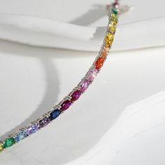 Radiance by Absolute™ Oval Stone Rainbow Tennis Bracelet There's no end to the rainbow of styling possibilities you'll discover in this line bracelet. Lots of sparkling, simulated diamond color make the spirited design such a vibrant and versatile look. Wear the piece as a statement single. Wear it as a stacking layer. Either way, it's a fab choice for special days or any day.        Approx. 6.75"L, 7.25"L or 8"L x 1/8"W      Stamped .925 sterling silver; platinum plating; polished finish      B Multicolor Cubic Zirconia Tennis Bracelet For Anniversary, Rainbow Cubic Zirconia Bracelet For Gift, Rainbow Cubic Zirconia Bracelet As Gift, Rainbow Cubic Zirconia Bracelets For Gift, Rainbow Cubic Zirconia Bracelets As Gift, Elegant Rainbow Round Bracelets, Elegant Rainbow Bracelets For Gifts, Elegant Rainbow Bracelets For Gift, Elegant Rainbow Cubic Zirconia Jewelry