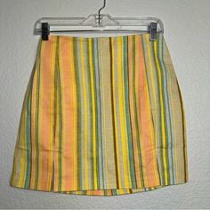 Love On A Hanger Size 5 Multi-Colored Striped Front Mini Skirt Back Zip Nwot 2 Front Slits Yellow, Brown, Violet, Orange, And Teal Excellent New Condition Without Tags Measurements Are Approximate: Waist -13 In Length - 16 In All Measurements Are Taken Flat. Colors May Vary Based On Lighting. Please Use These Measurements On Something You Own To Compare Before Purchasing. Multicolor Mini Bottoms For Summer, Striped Mini Skirt For Day Out, Multicolor Mini Length Summer Bottoms, Fitted Retro Skirt For Vacation, Retro Fitted Skirt For Vacation, Striped Mini Skort For Spring, Multicolor Mini Skirt For Summer Day Out, Spring Striped Mini Skort, Summer Striped Lined Skort