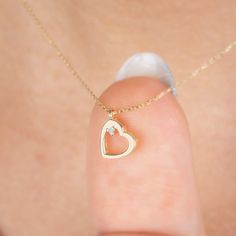 "Diamond Dangle Heart Necklace in 14k Solid Gold, Real Diamond Open Heart Necklace, Minimalist Heart Necklace, Heart Talisman, Valentine Gift F E A T U R E S * Made to Order. * Gold KT: 14K * Choice of Gold Color: Yellow Gold, Rose Gold, White Gold * Gem Stone: Genuine Diamond * Diamond-Cut: Round * Diamond Carat: 0.01 ct. * Pendant Height: 9,50 mm / 0.37 inch * Pendant Width: 7,50 mm / 0.30 inch * Diamond Color-Clarity: G.VS Color, SI Clarity * Length: 14\", 16\", 18\", 20\", 22\", 24\" * Setting Type: Bezel Setting * Ready to Ship in 1-3 Business Days * 100% US sourced * 2 Years Warranty * Free Express International Shipping * Free returns within 14 days from the order date We loved making our jewelry with special designs for your special moments. Wishing you to share the joy on a perfec Gold Heart Necklace With Diamonds, Delicate 14k Yellow Gold Heart Necklace, Fine Jewelry 14k Gold Heart Necklace With Birthstone, Wedding Fine Jewelry Heart Necklace With Charm, 14k Gold Pendant Charm Necklace For Valentine's Day, Fine Jewelry Heart Charm For Anniversary, Fine Jewelry Heart Charm For Anniversary Gift, 14k Gold Open Heart Necklace For Gift, Fine Jewelry White Gold Heart Necklace With Birthstone