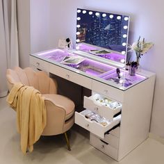 a vanity with lights on and a chair in front of the mirror that is lit up