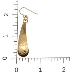 Long, slender and elegant, the Hammered Bronze Teardrop Earrings are the perfect choice for anyone who wants to make a statement with their earrings without being too dramatic. They feature a solid metal body that has a slight curve in it, offering plenty of depth. The earrings have a solid metal body that is elegantly hammered to add plenty of multifaceted detailing sure to help show off its shiny finish, especially in the light. They are handcrafted out of top-quality bronze metal that is able Elegant Adjustable Teardrop Earrings, Elegant Hammered Teardrop Earrings, Hammered Teardrop Earrings For Formal Occasions, Hammered Drop Earrings For Wedding, Elegant Hammered Dangle Teardrop Earrings, Elegant Hammered Teardrop Dangle Earrings, Elegant Hammered Teardrop Earrings For Gift, Formal Teardrop Hammered Jewelry, Adjustable Gold Teardrop Linear Earrings