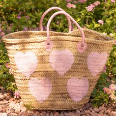 Handcrafted large straw bag with pink sequin hearts.This straw bag is hand woven with wicker palm straw sourced locally in Morocco. It has hand sewn pink sequins in the shape of hearts. The handles are genuine pink leather and are also handcrafted by Moroccan artisans. This bag has more than enough room for all your essentials! Use it as a beach bag, while running errands during the day, or even dress it up for a night on the town. This is the perfect fashion accessory to any outfit for any occa Pink Bucket Straw Bag With Braided Handles, Pink Handwoven Bucket Straw Bag, Handmade Pink Bucket Straw Bag, Pink Handwoven Straw Bag, Handmade Pink Straw Tote Bag, Pink Straw Bag With Braided Handles, Pink Woven Straw Tote Bag, Pink Handwoven Straw Bag For Summer, Kawaii Bags