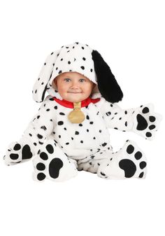 a baby dressed in a dalmatian costume