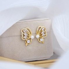 These stunning gold butterfly earrings will add the perfect touch of sparkle and elegance to your special event or even just everyday outfit! Made with high quality materials, these beautiful earrings will be sure to impress in person and in photographs. *Shipping: CANADA ORDERS: FREE SHIPPING TO CANADA. Sent WITHOUT TRACKING via Canada Post. Please allow 3-10 business days for them to arrive. US ORDERS: ORDERS are sent via Chit Chats with TRACKING. Please allow 3-5 business days for them to arr Butterfly Cubic Zirconia Earrings For Formal Events, Butterfly Cubic Zirconia Earrings For Formal Occasions, Butterfly-shaped Cubic Zirconia Earrings For Formal Occasions, Elegant Gold Butterfly Earrings, Elegant Gold Butterfly-shaped Earrings, Formal Butterfly Cubic Zirconia Earrings, Formal Butterfly-shaped Cubic Zirconia Earrings, Elegant Hypoallergenic Butterfly Jewelry, Elegant Wing-shaped Cubic Zirconia Jewelry