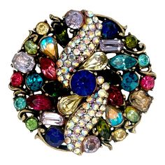 This is part of Chairish’s Costume Jewelry assortment.  This is a wonderful vintage brightly colored costume pin by the designer Hollycraft. The piece has prong set multi-color and multi shaped rhinestones. It is signed Hollycraft and looks fabulous on a coat or blazer. Condition is excellent. Dimensions; Diameter: 2", Weight: 29.4 grams Elegant Multicolor Collectible Brooches, Elegant Multicolor Brooch Pins, Collectible Multicolor Costume Jewelry Brooches, Vintage Multicolor Collectible Brooches, Retro Rhinestone Brooches For Gifts, Unique Multicolor Collectible Brooches, Multicolor Party Jewelry With Brooch, Unique Multicolor Jewelry Brooch, Unique Multicolor Jewelry With Brooch