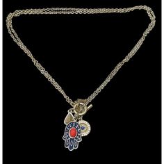 Vintage Hamsa charm necklace from Vintage America by Alan West. Alan West Vintage America Hamsa charm necklace is a beautifully crafted piece of history offering a blend of vintage elegance and spiritual symbolism. Its intricate design and antique finish make it a statement piece. * Vintage inspired hamsa charm * Crafted with attention to detail * Antique finish for authentic look * Perfect statement piece * Symbolizes protection and good luck * 15 inches * 1 3/4 inch charm cluster * Front toggle clasp * Signed Alan West Vintage America Condition: Pre-Owned Like New Symbolic Vintage Medallion Jewelry With Charm, Vintage Charm Medallion Necklace Amulet Style, Vintage Charm Medallion Amulet Necklace, Vintage Charm Medallion Necklace Styled As Amulet, Vintage Medallion Necklace With Amulet Style, Vintage Charm Amulet Necklace, Symbolic Charm Necklaces With Vintage Charm As Gift, Symbolic Charm Necklaces With Vintage Charm For Gifts, Symbolic Charm Necklace With Vintage Charm As Gift