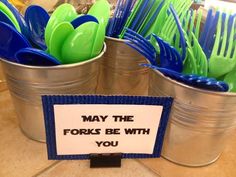 there are many forks in the buckets and one has a sign that says may the forks be with you