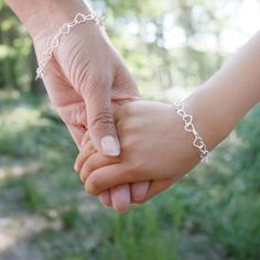 This sterling silver heart bracelet is an adorable way of showing someone how much you love them. Forever linked, forever loved.Made from 925 sterling silver with a bracelet chain length of 20cm.This silver heart bracelet is the perfect gift from a Mother to a daughter, Bride to bridesmaids, sister to sister, husband to wife. The linked hearts symbolise never ending love, friendship and devotion.Want to personalise your bracelet for no extra charge? We can print your message on our bespoke cards Adjustable Heart Bracelet With Jubilee For Valentine's Day, Adjustable Heart Jubilee Bracelet For Valentine's Day, Adjustable Jubilee Heart Bracelet For Valentine's Day, Mother's Day Double Heart Friendship Bracelet, Heart-shaped Name Bracelet For Valentine's Day And Birthday, Mother's Day Heart-shaped Hypoallergenic Name Bracelet, Hypoallergenic Heart-shaped Name Bracelet For Mother's Day, Heart Bracelet For Mother's Day Friendship, Mother's Day Heart Charm Bracelet