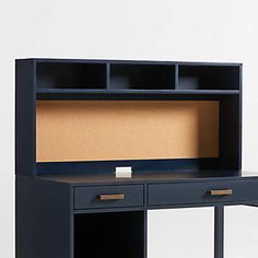 an office desk with two drawers and a cork board on the top, against a white background