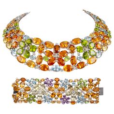 Statement mixed color stone with diamond necklace and bracelet set. By Alexander Beverly Hills. 304.87 carats total gemstone weight. Necklace 166.33 carats total gemstone weight. 154.51 carats of heliodor beryl, peridot, and aquamarine. 179 round brilliant diamonds, 11.82 carats. Approximately G/H color grade and SI clarity grade. 18-karat white gold, 16 inches. Bracelet 138.54 carats total gemstone weight. 128.00 carats of heliodor beryl, peridot, amethyst and aquamarine. 98 round brilliant diamonds, 10.54 carats. Approximately G/H color grade and SI clarity grade. 18-karat white gold, 7 inches. Willing to sell necklace or bracelet separately. Accommodated with an up-to-date digital appraisal by a GIA G.G. once purchased, upon request. Please contact us with any questions. Item Number N59 Art Deco Pendant Necklace, Bezel Set Necklace, Colored Diamond Jewelry, Funny Jewelry, Diamond Chain Necklace, Stone Necklace Set, Fancy Jewellery Designs, Necklace And Bracelet Set, Jewelry Brands