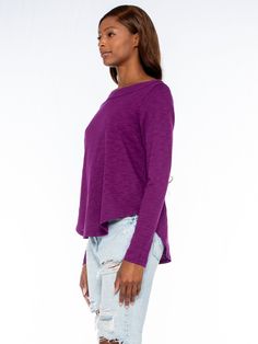 Shrunken Long Sleeve Bateau Neck Shirttail Tee. In Our Signature Slub Fabrication. Made in the USA. Model is wearing a size Small Fabric Content:100% Cotton Purple Crew Neck Top For Layering, Purple Cotton Top For Layering, Purple Relaxed Fit Crew Neck Blouse, Purple Relaxed Fit Top For Fall, Stretch Long Sleeve Tops For Casual Wear, Stretch Long Sleeve Top For Casual Gatherings, Purple Relaxed Fit Long Sleeve Top, Purple Long Sleeve Relaxed Fit Top, Essential Tops