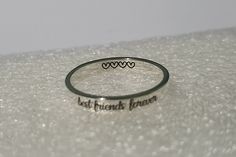 "✤ Unique and personalized best friend ring, you can add name, date, initials, quote, signature, handwriting, picture, etc. Make it only one piece in the world. ✤ Can engrave both inside and outside 20 characters limit (inside + outside < 20 characters, all sign, and symbols are counted) If you want to engrave more than 20 characters, please buy this list >> https://www.etsy.com/listing/725423787/extra-engrave-characters ✤ Made with .925 silver, will not tarnish. easy to clean and maint Personalized Adjustable Rings For Friendship, Adjustable Personalized Rings For Friendship, Custom Text Engraved Silver Ring For Gift, Personalized Silver Friendship Rings, Personalized Sterling Silver Rings For Friendship, Silver Engraved Ring With Custom Text For Anniversary, Silver Engraved Ring For Anniversary With Custom Text, Silver Anniversary Ring With Custom Engraving, Sterling Silver Friendship Ring