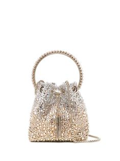 Bon Bon crystal-embellished bucket bag from JIMMY CHOO featuring gold-tone, silver-tone, crystal, metal, satin weave, crystal embellishment, engraved logo, single circular top handle, chain-link shoulder strap, open top, drawstring fastening and main compartment. Glamorous Bucket Evening Bag, Elegant Bucket Bag With Rhinestones, Silver Bucket Evening Bag, Elegant Silver Bucket Bag For Evening, Elegant Silver Bucket Bag For Party, Elegant Rhinestone Bucket Bag, Glamorous Bucket Evening Bag For Events, Glamorous Evening Bucket Bag, Elegant Bucket Bag With Silver-tone Hardware And Top Handle