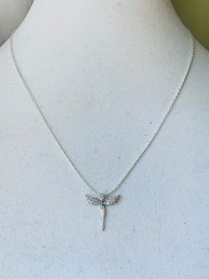 This charming silver angel necklace is 18in. The angel charm is 3/4 x 3/4. If you have any questions please don't hesitate to ask Silver Angelic Jewelry For Gift, Angelic Silver Jewelry For Gift, Silver Angel Wings Necklace As Gift, Silver Angel Wings Pendant Necklace, Silver Dainty Charm Necklace 16 Inch, Dainty Silver Charm Necklace 16 Inch, Angel Charm, Chunky Statement Necklace, Angel Necklace