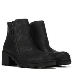 a pair of black boots with zippers on the side and heeled soles