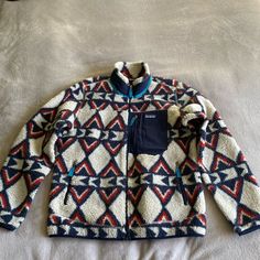 Patagonia Classic Retro X Fleece Jacket Sz L In Brass Hawk Pattern. Condition Is Excellent. From Patagonia: "A Warm And Windproof Layer That Rocks An Updated Retro Look From Patagonia’s Archives. New To Their Lineup Of Excellent Outerwear, The Classic Retro-X Jacket Takes The Look Of A Vintage Fleece Zip-Up (A Look Patagonia Pretty Much Invented About 35 Years Ago) And Pairs It Up With Modern Materials That Cut Wind, Trap Warmth, And Keep The Vibe Properly Chill. Patagonia Long Sleeve Fleece Jacket For Hiking, Multicolor Fleece Outerwear For Outdoor, Multicolor Fleece Outdoor Outerwear, Multicolor Long Sleeve Outerwear For Hiking, Blue Winter Hiking Fleece Jacket, Patagonia Blue Winter Outerwear, Blue Patagonia Outerwear With Pockets, Blue Patagonia Winter Outerwear, Winter Blue Patagonia Outerwear